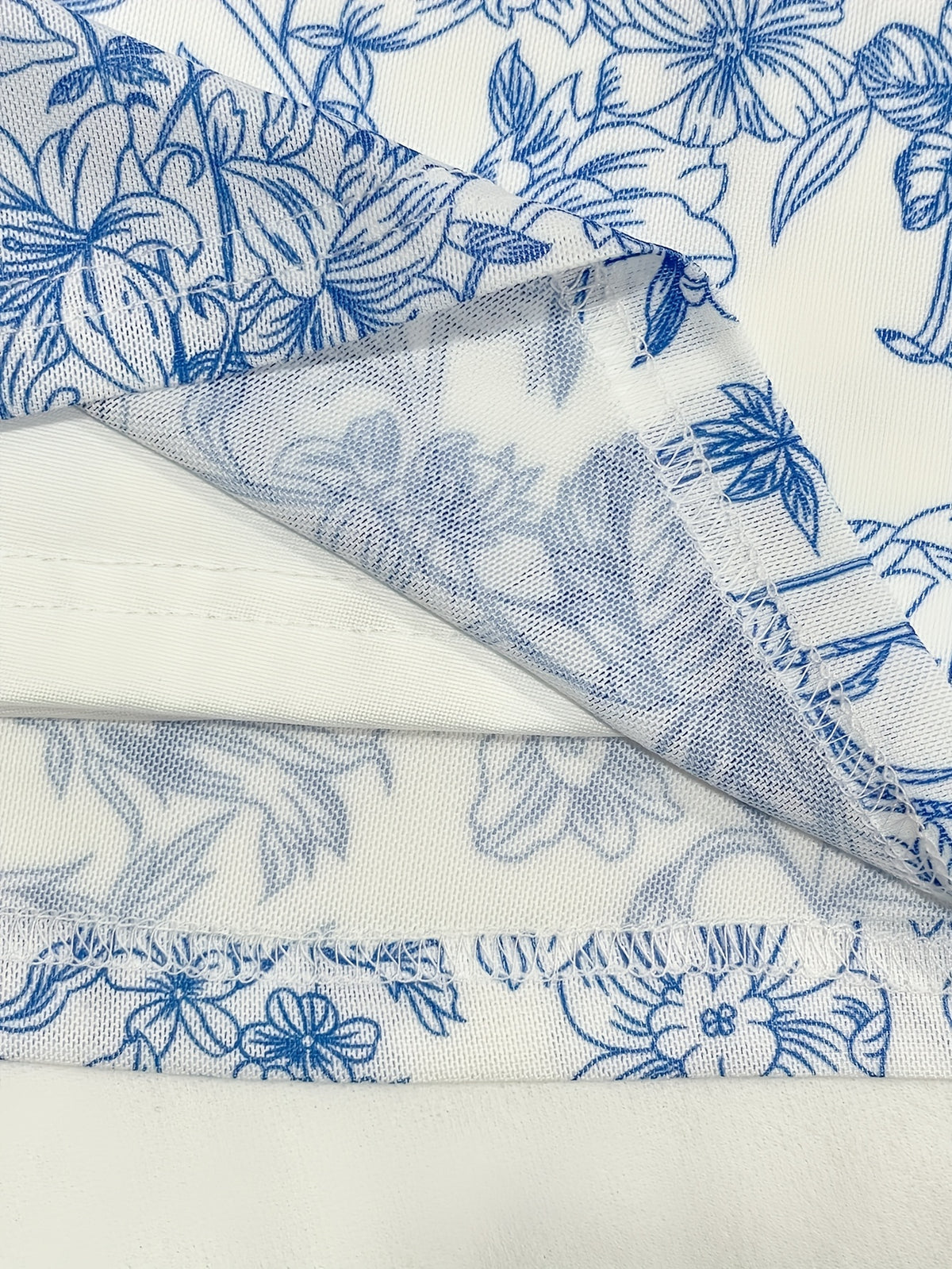 Elegant Blue Floral Print V-Neck Dress with Tie-Back Detail - Sleeveless, Knee-Length, Perfect for Spring\u002FSummer, Romantic Holiday Style, Floral Dress